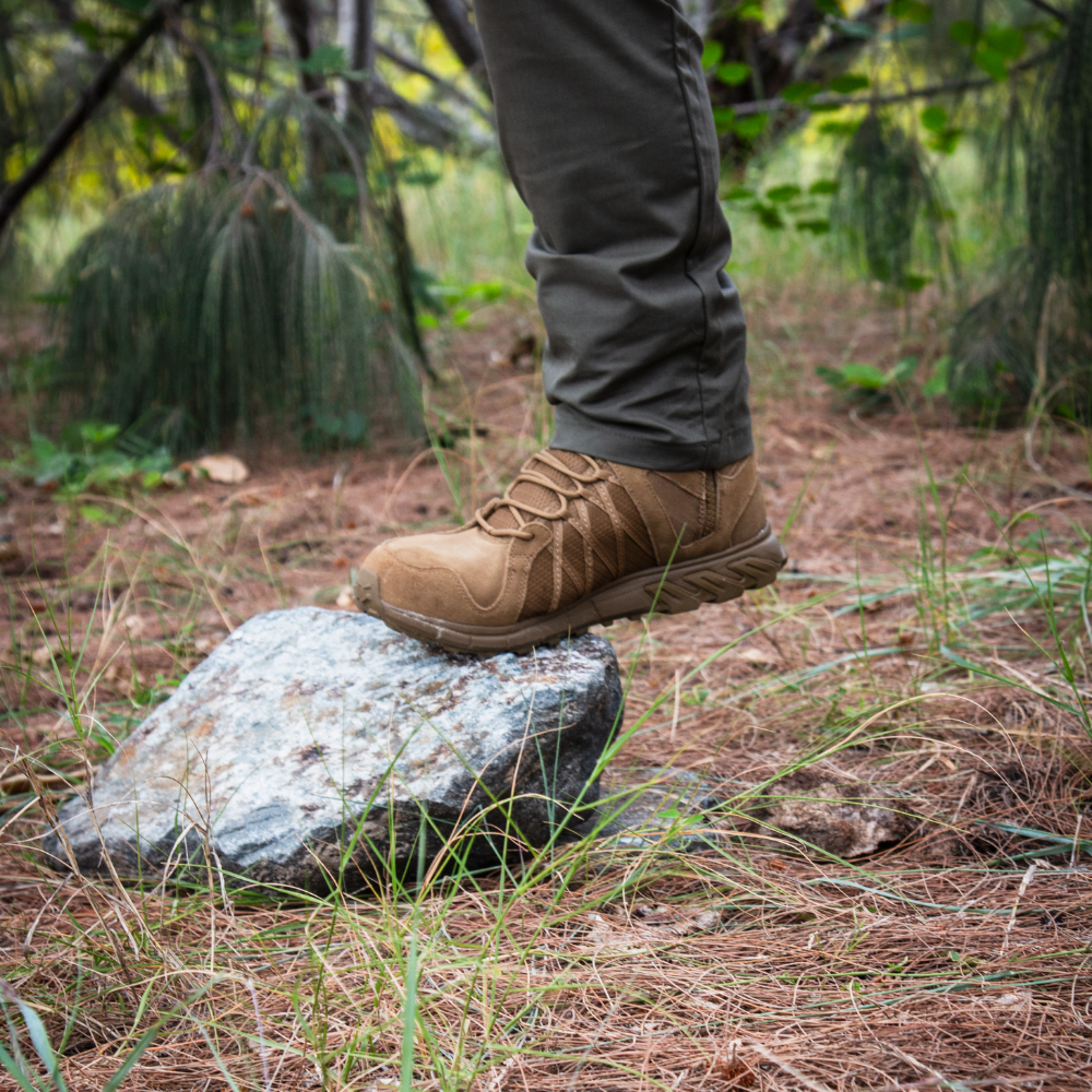 Person wearing Reebok Trailgrip Tactical 8 side zip boot