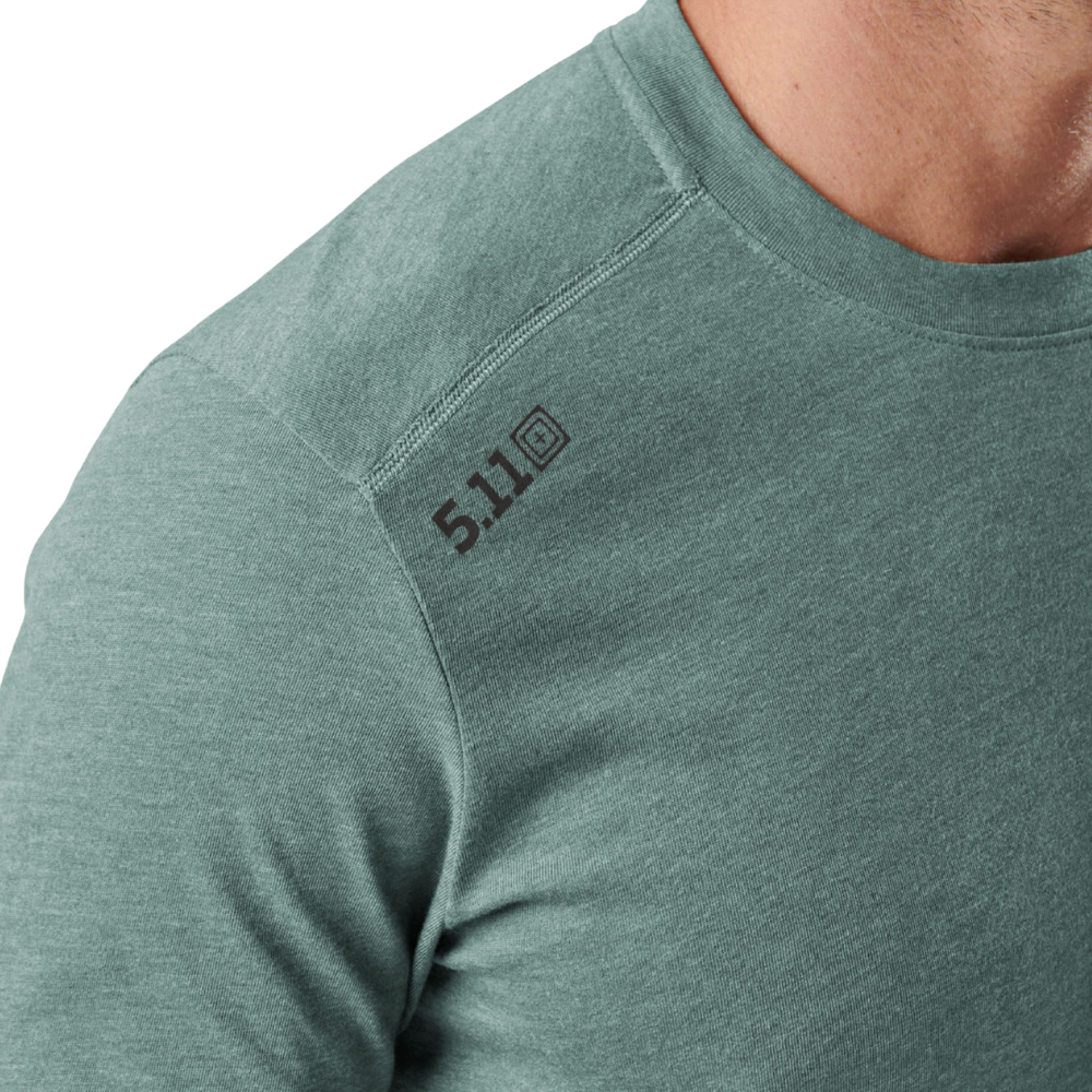 Close-up of the shoulder logo on the 5.11 Tactical PT-R Charge Long Sleeve 2.0 in Willow Green Heather