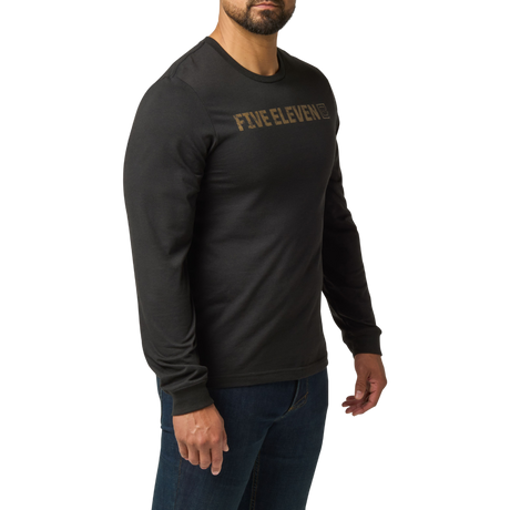 Man wearing the 5.11 Tactical Weathered Lock Up Long Sleeve Tee in Black with a distressed tan Five Eleven chest print, angled to the right