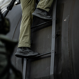 Person wearing Reebok Nano X1 Adventure 6 tactical side zip boot in black