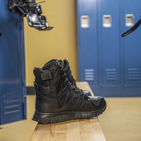 Person wearing Reebok Trailgrip Tactical 8 side zip waterproof boot in black